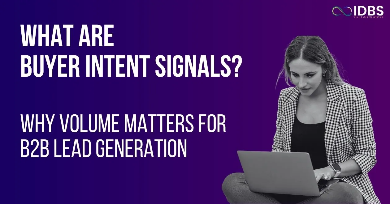 Woman on laptop with text "WHAT ARE BUYER INTENT SIGNALS? WHY VOLUME MATTERS FOR B2B LEAD GENERATION" and IDBS logo.